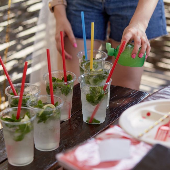 Young woman at a bachelorette party makes a mojito cocktail for the company preparation instructions step 